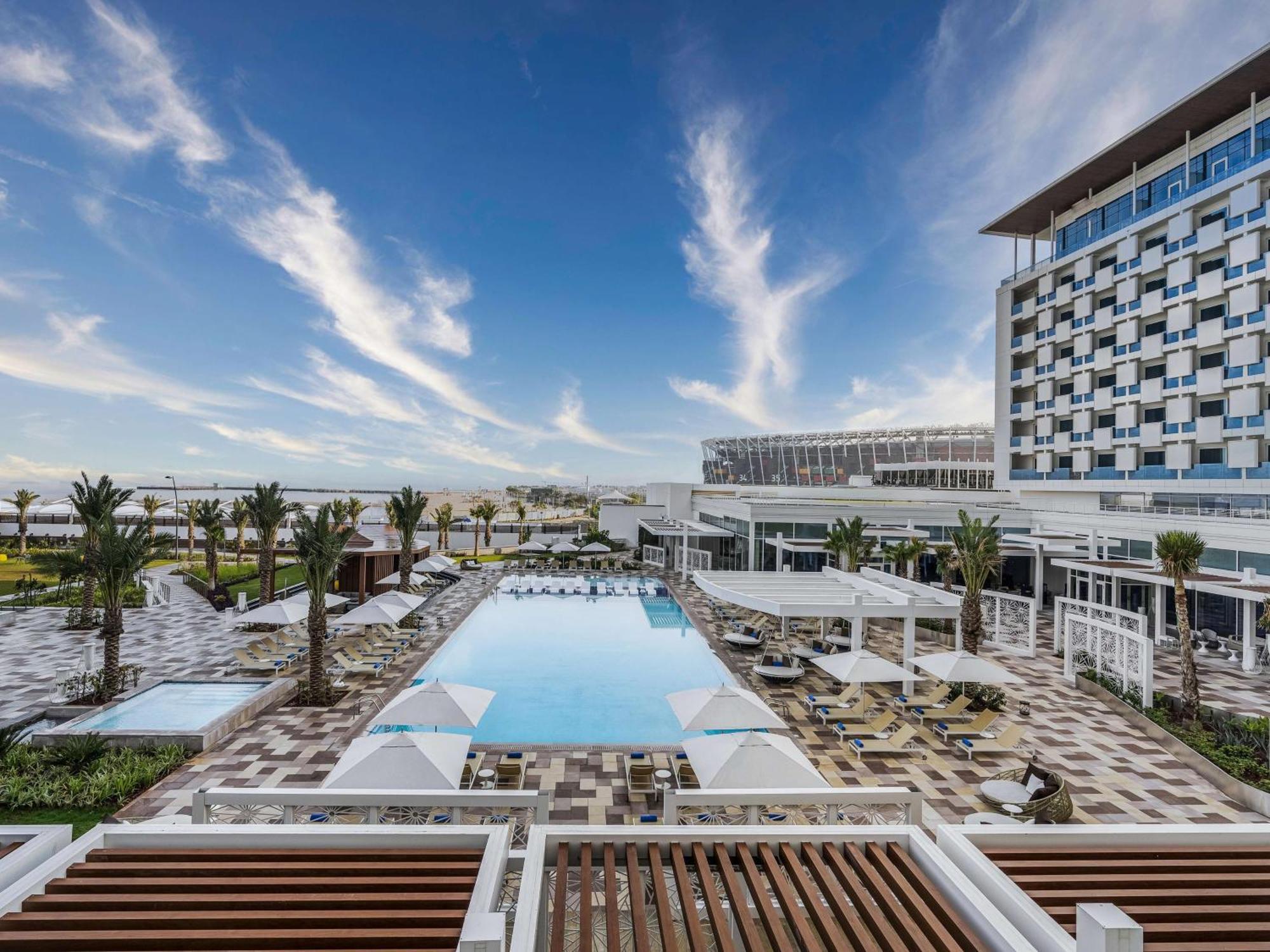 Rixos Gulf Hotel Doha Exterior photo The swimming pool at the hotel