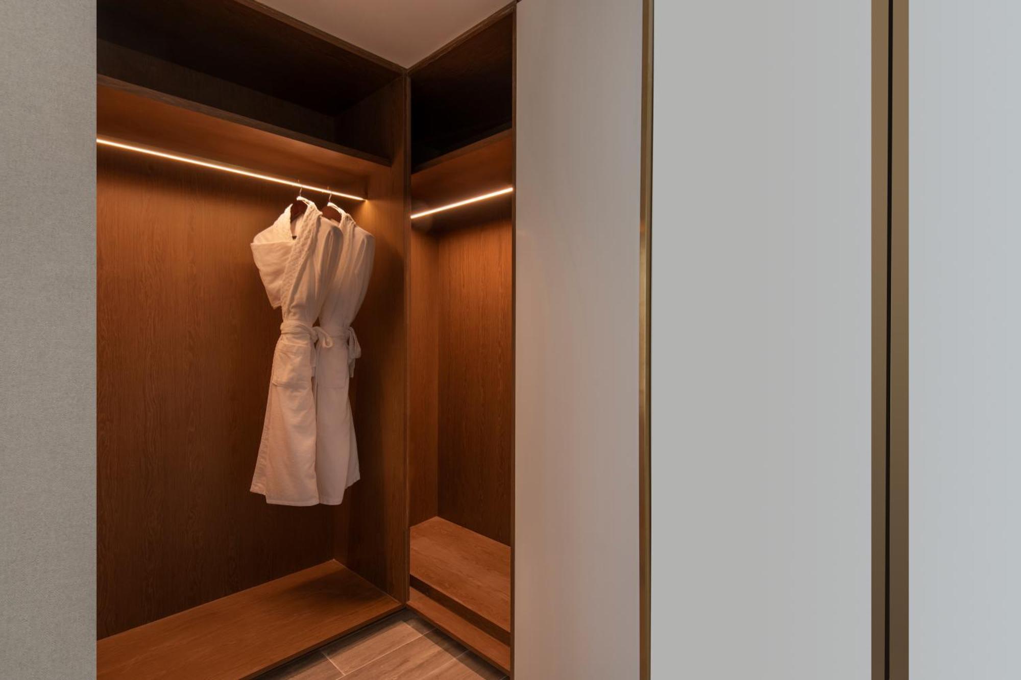 Rixos Gulf Hotel Doha Exterior photo A bathrobe hanging in a closet